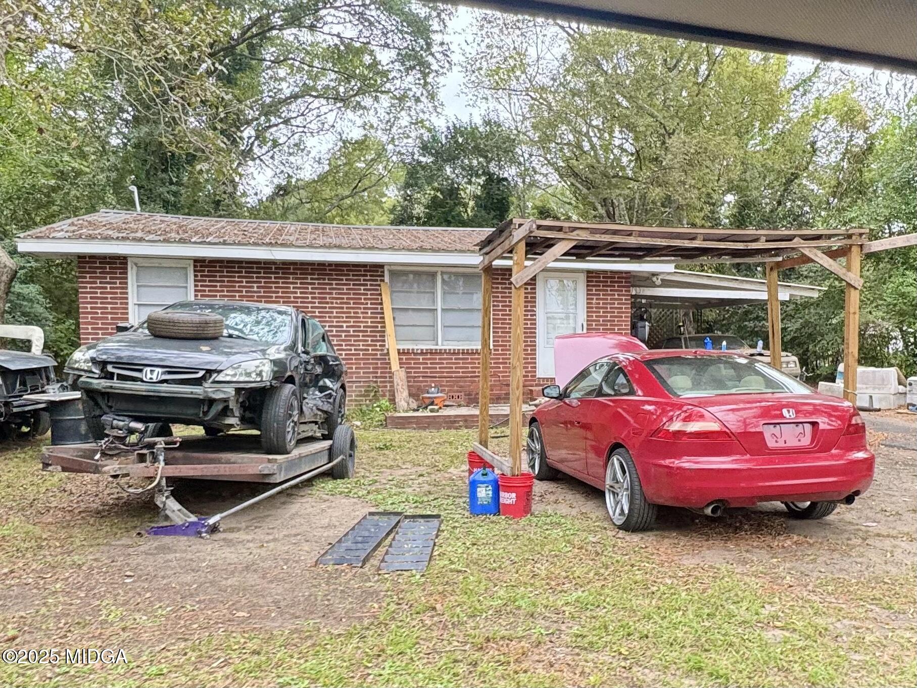 875 Artic Circle Macon, GA 31217 - Photo 1 of 1 a backyard of a house with yard fire pit and outdoor seating