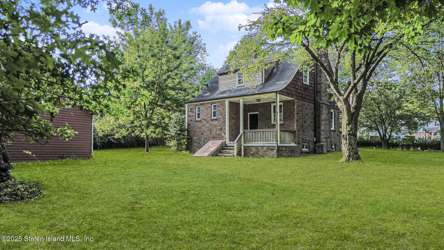 777-805 Willowbrook Road Staten Island, NY 10314 - Photo 7 of 12 a view of a house with a backyard