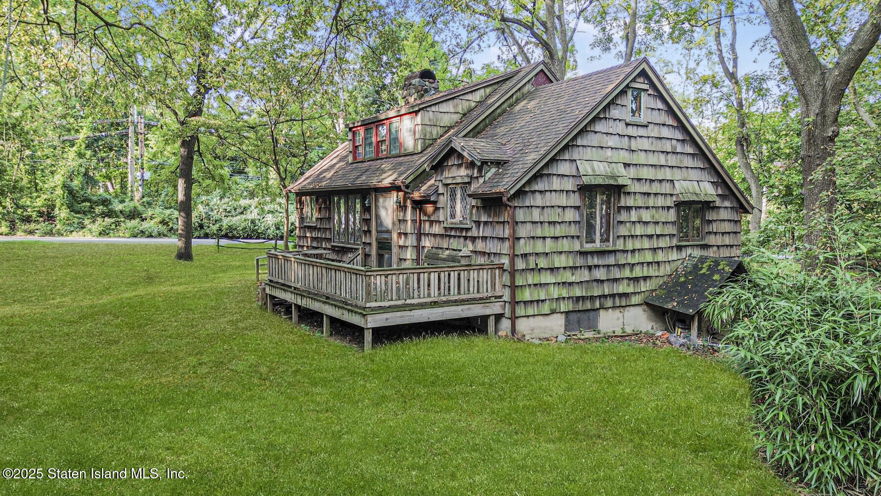 777-805 Willowbrook Road Staten Island, NY 10314 - Photo 10 of 12 a view of a house with a yard and deck