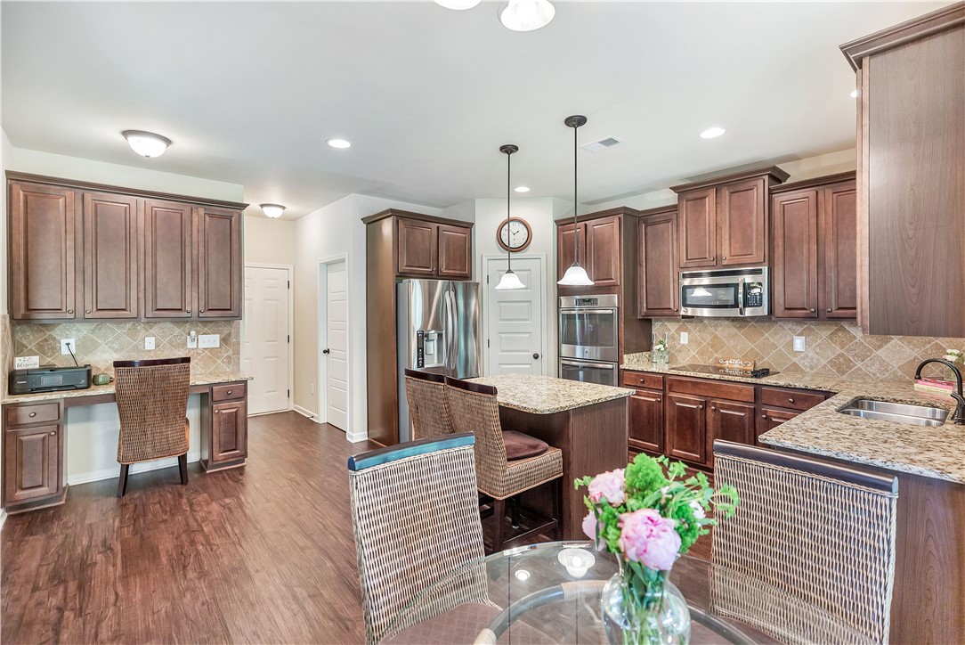 144 Buckland Drive Anderson, SC 29621 - Photo 35 of 48 A gourmet kitchen offers rich wood cabinetry, granite countertops, and modern stainless steel appliances.