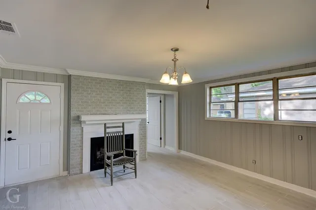 a view of a livingroom with a fireplace and furniture