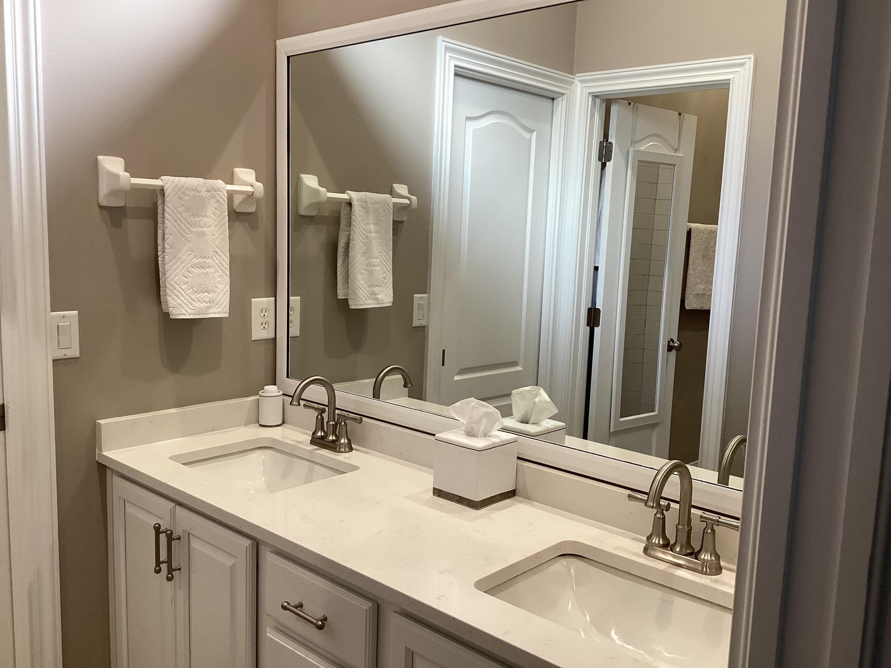 776 Ocean Palm Way St. Augustine, FL 32080 - Photo 13 of 38 a bathroom with a sink and a mirror