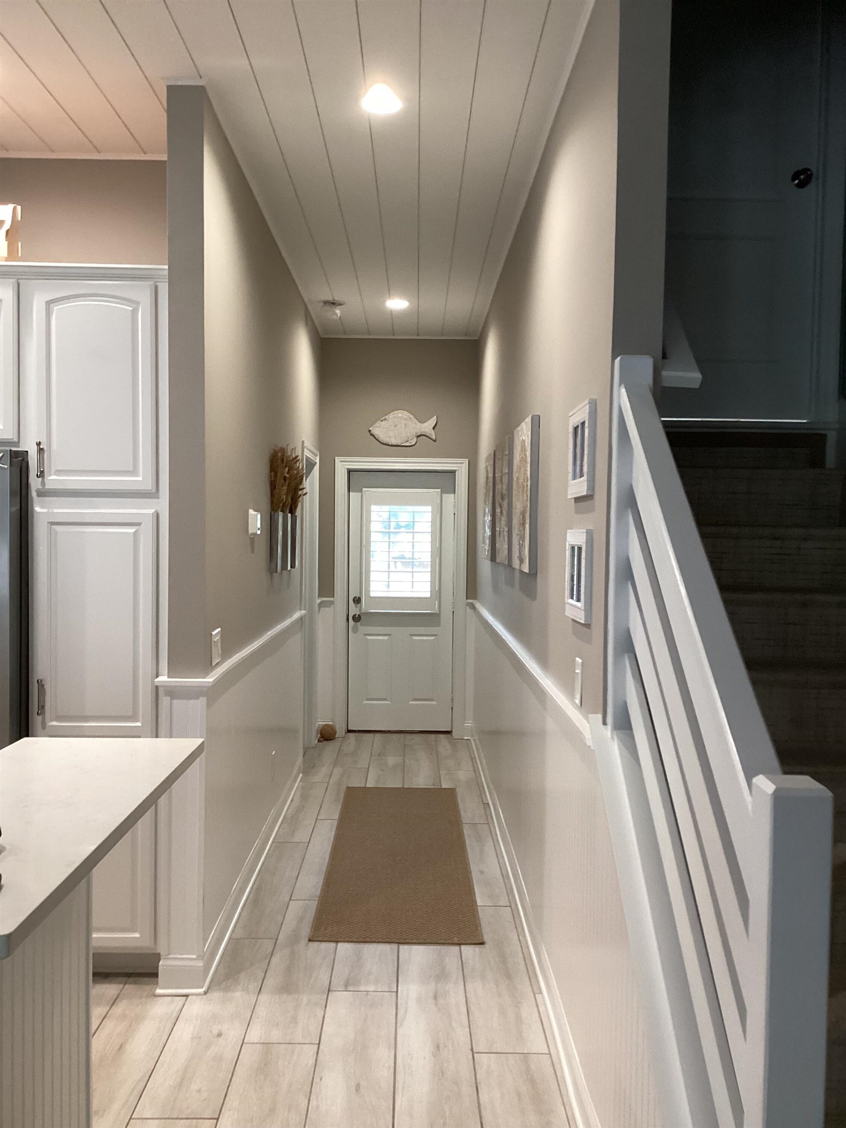 776 Ocean Palm Way St. Augustine, FL 32080 - Photo 9 of 38 a view of a hallway with windows