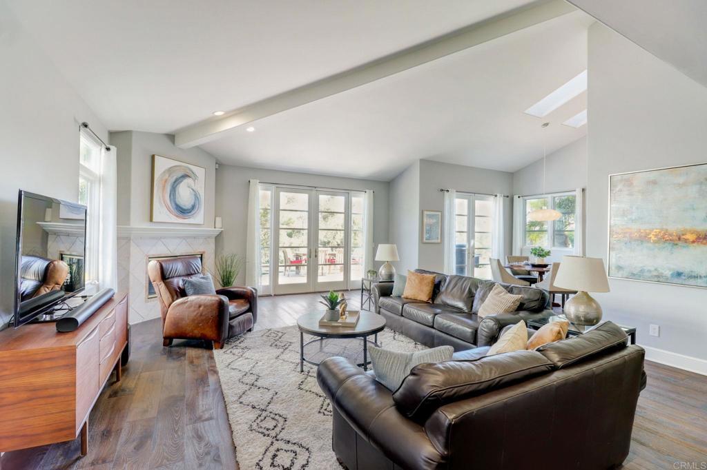 7180 Aviara Drive Carlsbad, CA 92011 - Photo 13 of 43 a living room with furniture and a flat screen tv