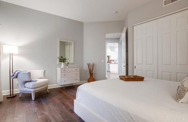 a bedroom with a bed and a couch