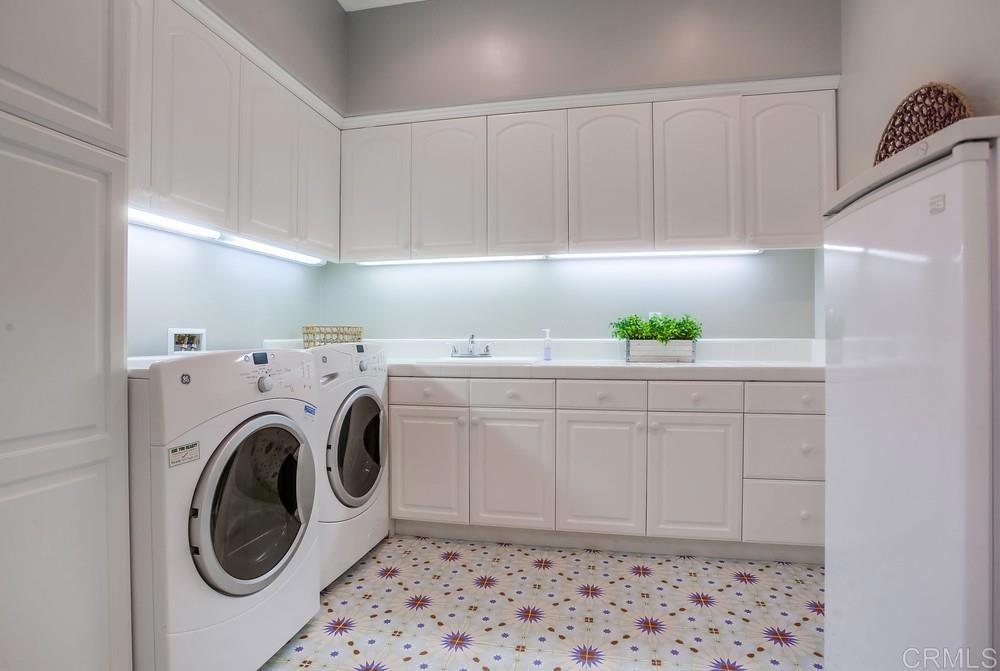 7180 Aviara Drive Carlsbad, CA 92011 - Photo 19 of 43 a utility room with cabinets
