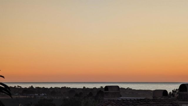 a white bath tub sitting in a bathroom next to a window