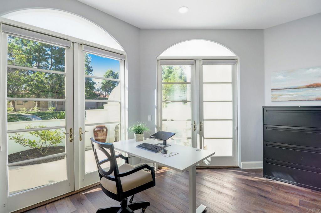 7180 Aviara Drive Carlsbad, CA 92011 - Photo 8 of 43 a workspace with wooden floor and a window