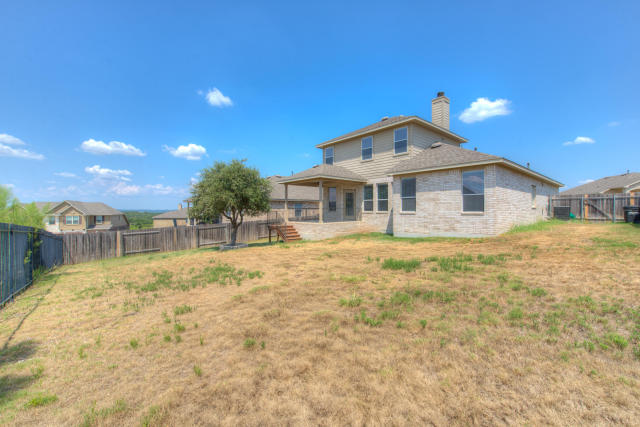 321 Limestone Trail Austin, TX 78737 - Photo 27 of 28 a view of a house with a yard