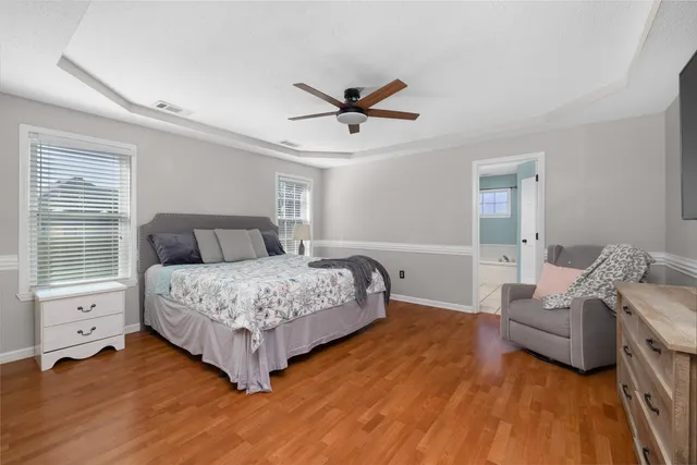 a bedroom with a bed and furniture