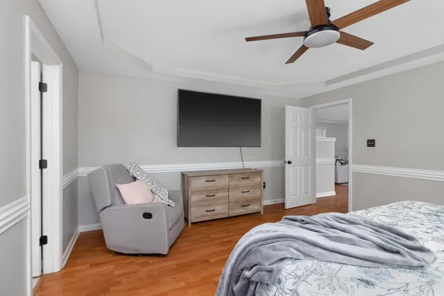 a bedroom with furniture and a window