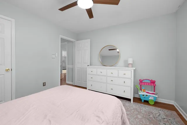 a bedroom with a bed and a dresser