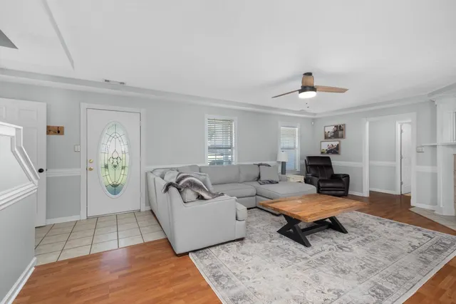 a living room with furniture and a rug