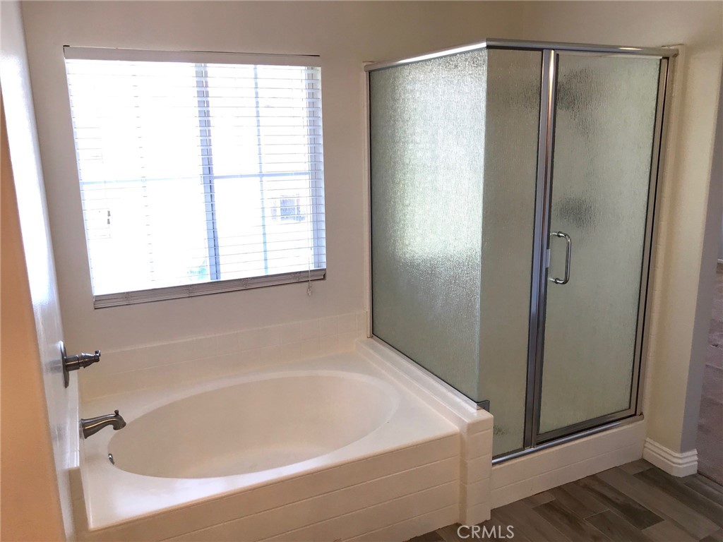 15 Brookhollow Irvine, CA 92602 - Photo 8 of 8 a white bath tub sitting next to a window