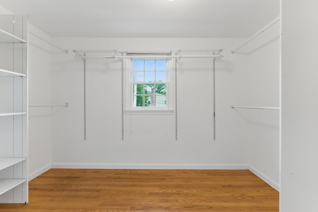 6 Willow Park Wellesley, MA 02481 - Photo 23 of 37 a view of an empty room with wooden floor and a window