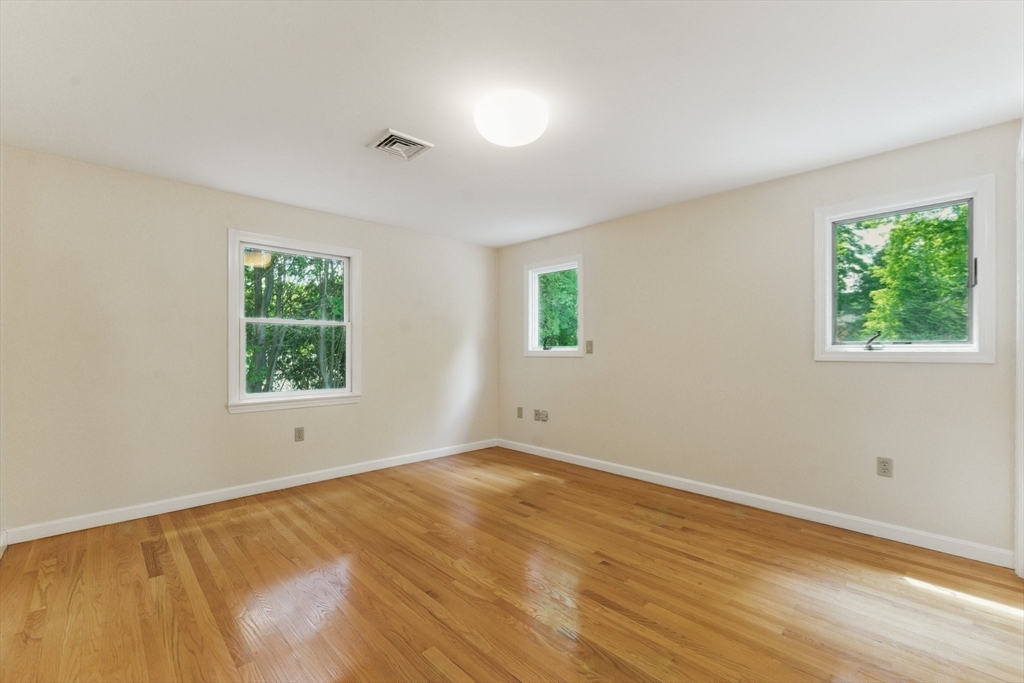 6 Willow Park Wellesley, MA 02481 - Photo 29 of 37 a view of an empty room with wooden floor and a window