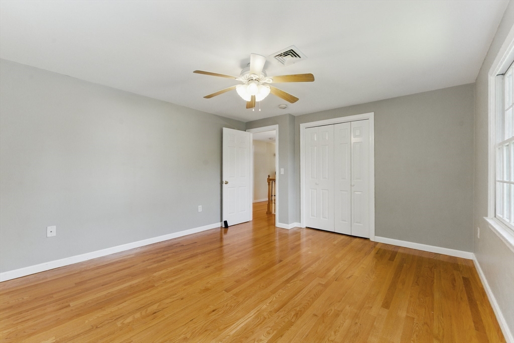 6 Willow Park Wellesley, MA 02481 - Photo 30 of 37 a view of an empty room with window and wooden floor