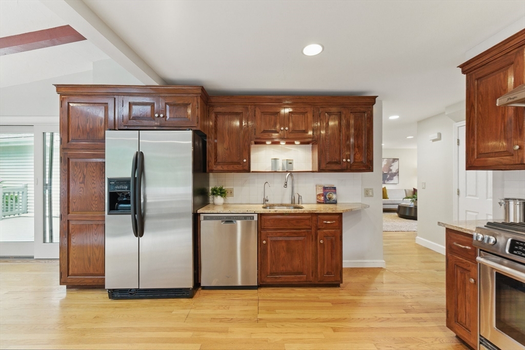 6 Willow Park Wellesley, MA 02481 - Photo 8 of 37 a kitchen with stainless steel appliances granite countertop a refrigerator and a stove