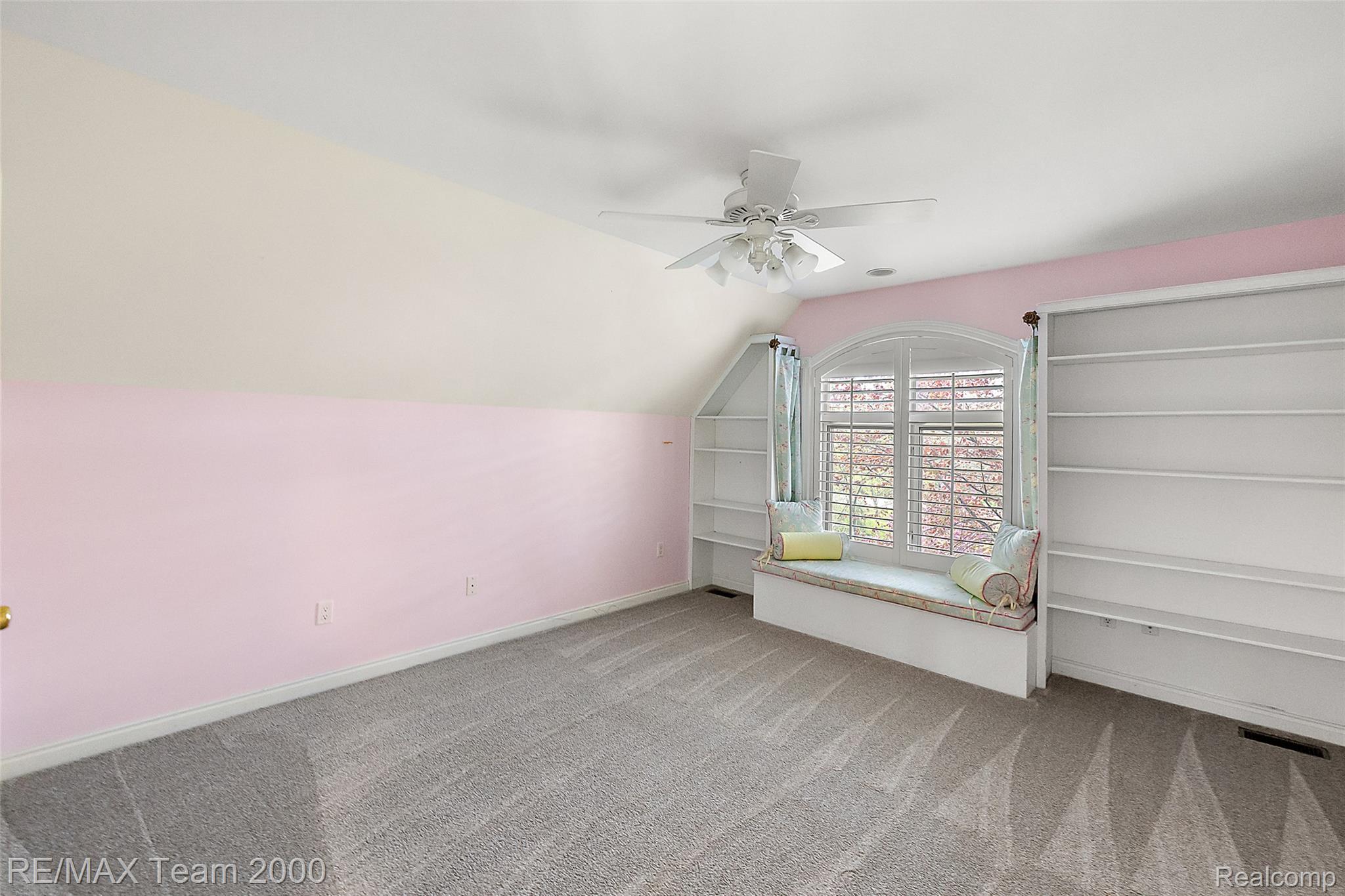 630 Sheldon Court Rochester, MI 48306 - Photo 55 of 94 Bonus room featuring ceiling fan, lofted ceiling, and light colored carpet