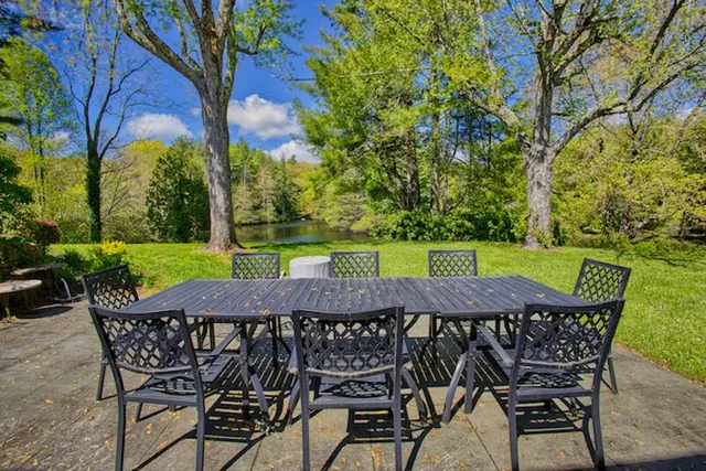 a view of a garden with a lake view