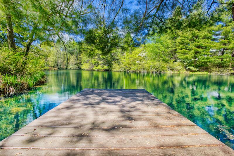 1436 Mayberry Church Road Meadows Of Dan, VA 24120 - Photo 26 of 38 a view of a lake with a big yard