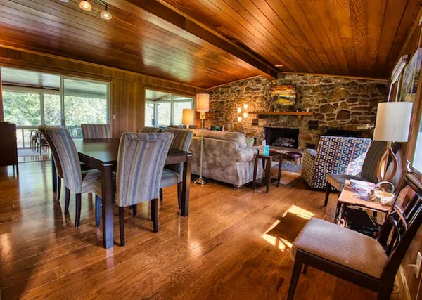 a view of a livingroom with furniture and a table