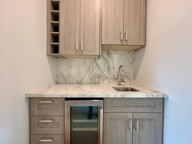 a spacious bedroom with a bed and a couch