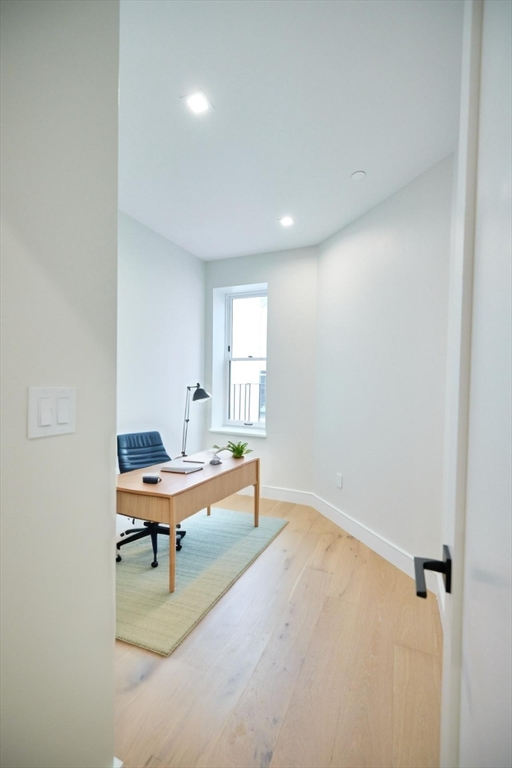 246 Newbury Street, Unit PH Boston, MA 02116 - Photo 20 of 22 a view of a workspace with furniture