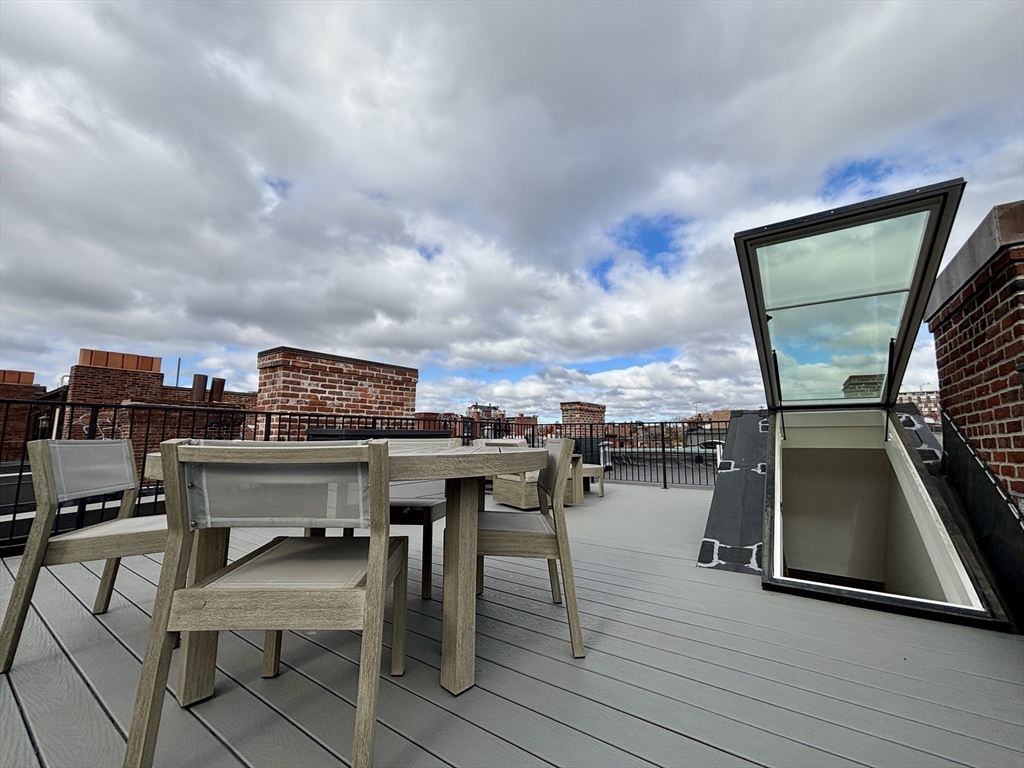 246 Newbury Street, Unit PH Boston, MA 02116 - Photo 2 of 22 a view of a terrace with seating area and furniture