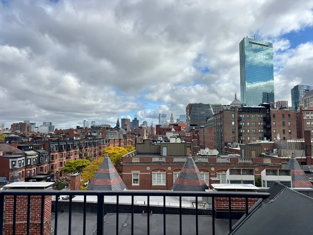 a view of a city skyline from a roof deck