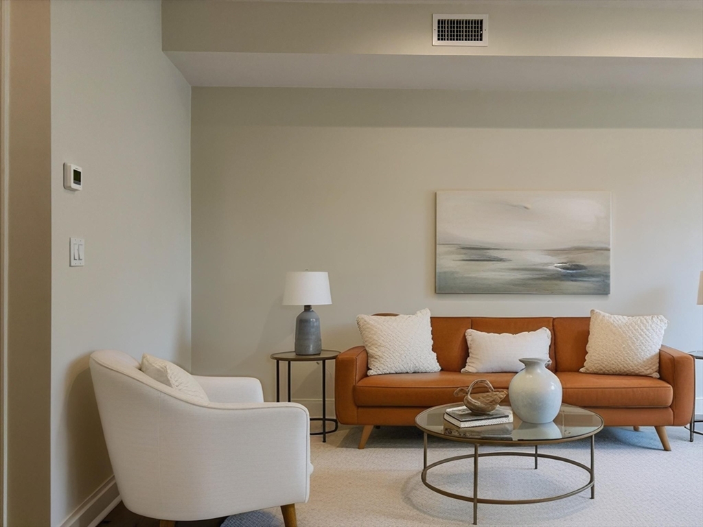 246 Newbury Street, Unit PH Boston, MA 02116 - Photo 7 of 22 a living room with furniture and a lamp