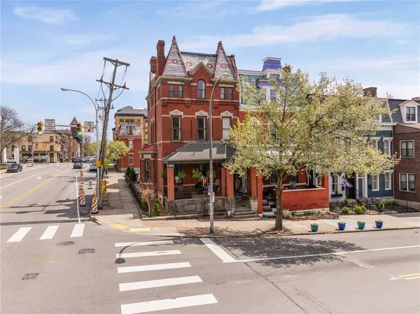 a view of a street with cars