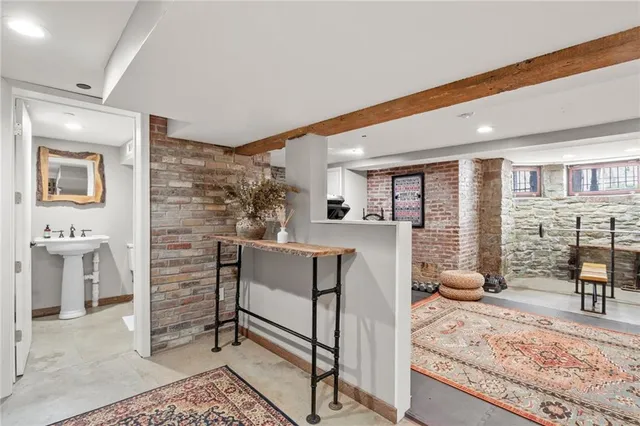a living room with furniture a dining table and chairs