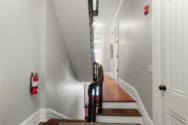 a view of an entryway with wooden floor