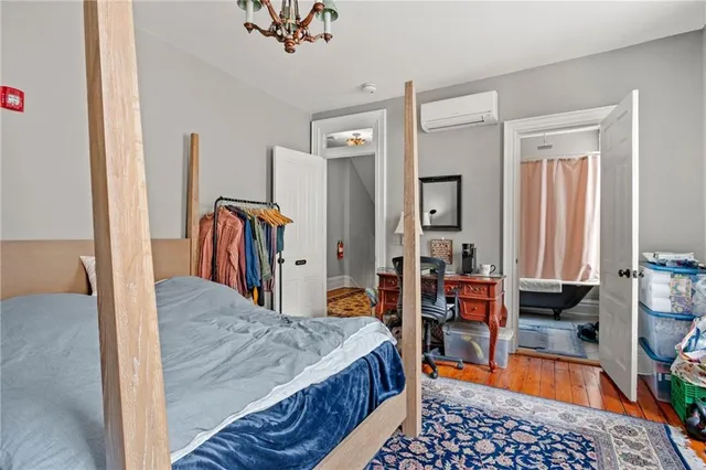 a bed room with a bed and dresser