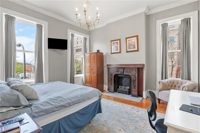 a bedroom with a bed and a fireplace