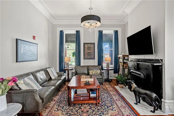 a living room with furniture and a flat screen tv