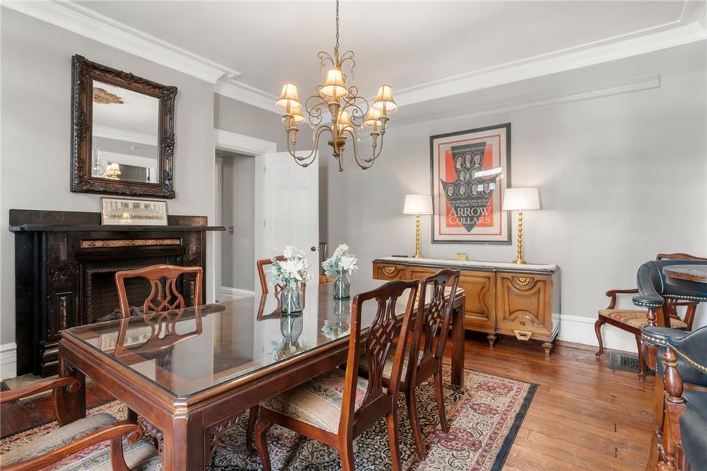 1010 Cedar Avenue Pittsburgh, PA 15212 - Photo 8 of 50 a dining room with furniture a chandelier and wooden floor
