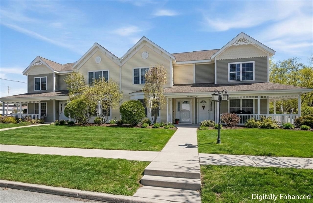 a front view of a house with a garden