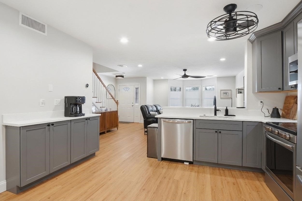 25 Greeley Street, Unit 2 Clinton, MA 01510 - Photo 12 of 33 a kitchen with a sink and cabinets
