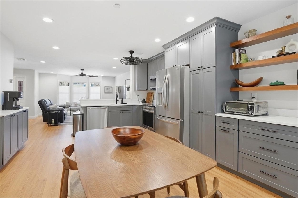 25 Greeley Street, Unit 2 Clinton, MA 01510 - Photo 13 of 33 a kitchen with stainless steel appliances granite countertop a sink a stove a refrigerator cabinets and chairs