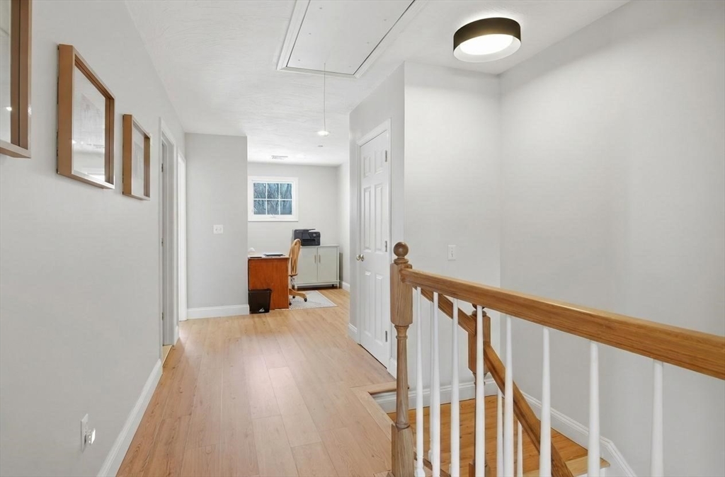 25 Greeley Street, Unit 2 Clinton, MA 01510 - Photo 18 of 33 a view of a hallway with wooden floor and a bathroom