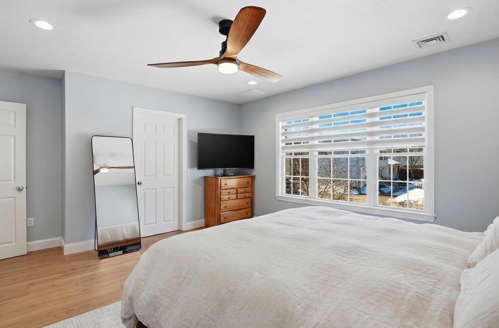 25 Greeley Street, Unit 2 Clinton, MA 01510 - Photo 21 of 33 a bedroom with a bed and a flat screen tv