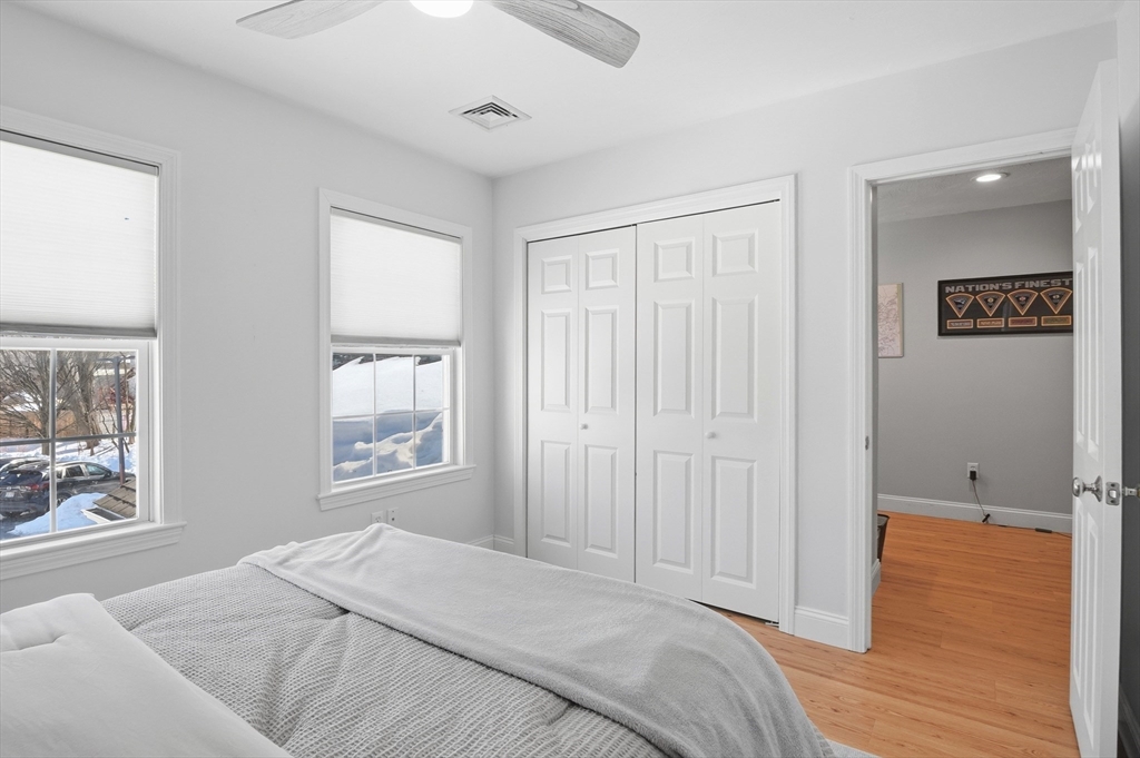 25 Greeley Street, Unit 2 Clinton, MA 01510 - Photo 24 of 33 a bedroom with a bed and a window