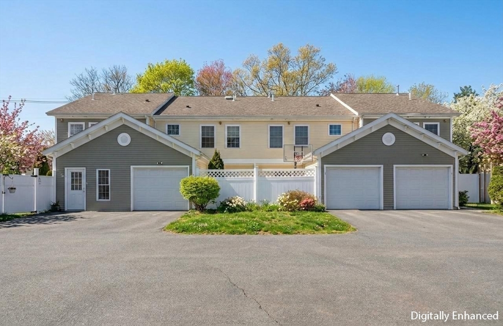 25 Greeley Street, Unit 2 Clinton, MA 01510 - Photo 32 of 33 front view of a house with a small yard
