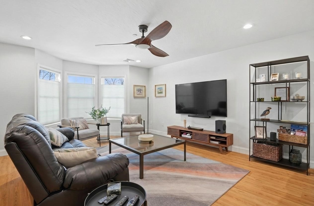 25 Greeley Street, Unit 2 Clinton, MA 01510 - Photo 6 of 33 a living room with furniture and a flat screen tv