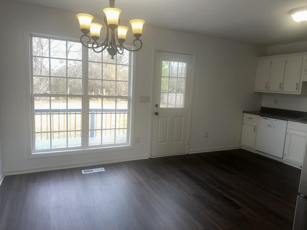 205 Daisy Lane Chatsworth, GA 30705 - Photo 15 of 34 a view of an empty room with wooden floor and a window