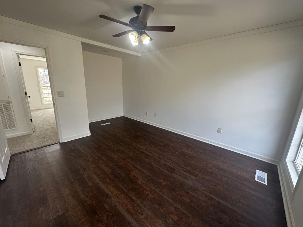 205 Daisy Lane Chatsworth, GA 30705 - Photo 20 of 34 an empty room with wooden floor fan and window