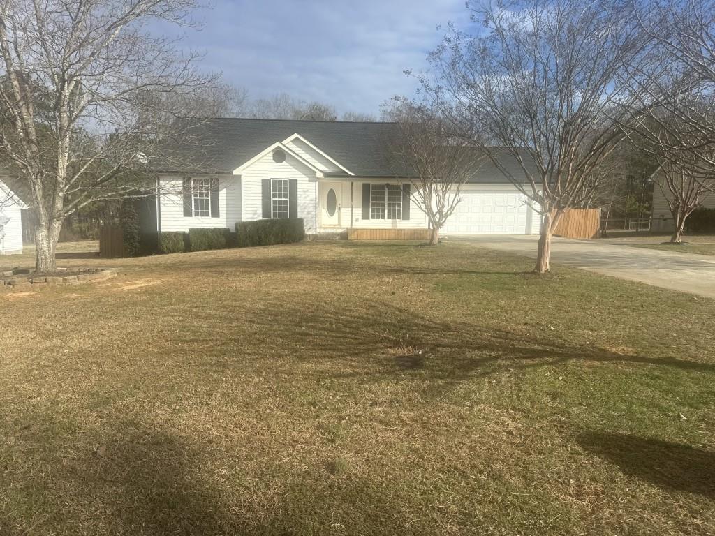 205 Daisy Lane Chatsworth, GA 30705 - Photo 34 of 34 a view of an house with backyard and tree