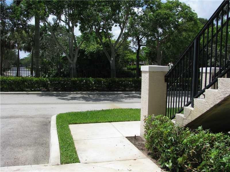 5800 West Sample Road, Unit 305 Coral Springs, FL 33067 - Photo 13 of 28 a view of a park with pathway